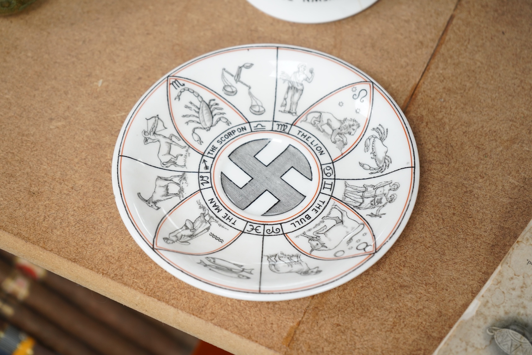 A Royal Doulton 'The Egyptian Divining cup and saucer', with booklet, numbered RN543665